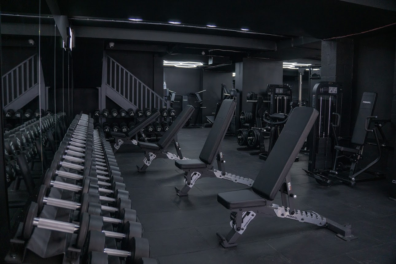 Hype Gym dumbbell area with adjustable benches and full dumbbell rack